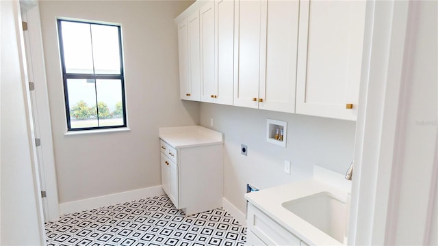 2073 Treasure Ln, Punta Gorda, FL 33982 - washroom with hookup for an electric dryer, cabinet space, and hookup for a washing machine