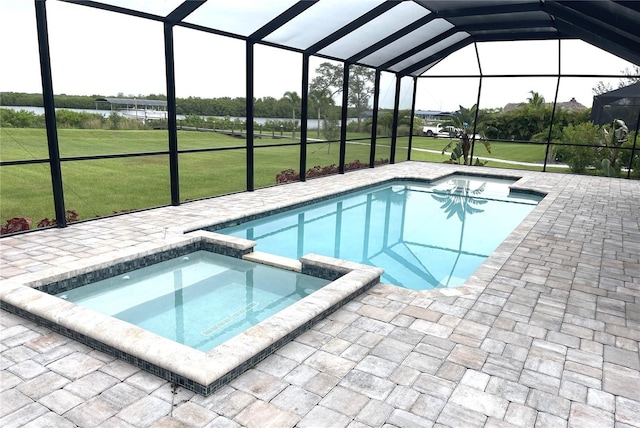 2073 Treasure Ln, Punta Gorda, FL 33982 - view of swimming pool with a pool with connected hot tub, a patio, a lanai, and a lawn
