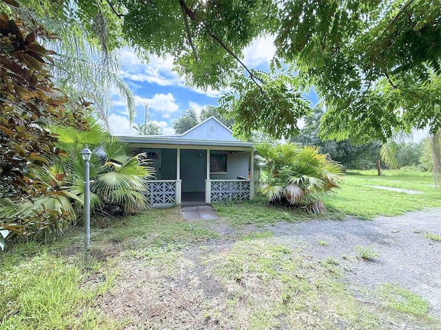 1426 Gary St, Punta Gorda, FL 33982 - view of front of property with a porch and a front yard
