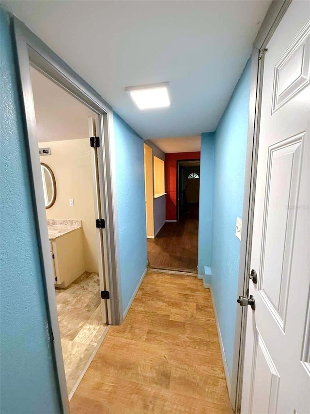 1426 Gary St, Punta Gorda, FL 33982 - corridor with light wood-type flooring and baseboards