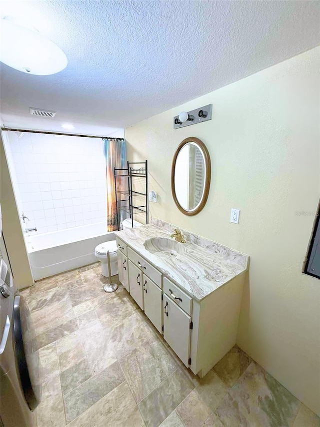 1426 Gary St, Punta Gorda, FL 33982 - bathroom featuring vanity, shower / tub combo, a textured ceiling, and stone finish floors