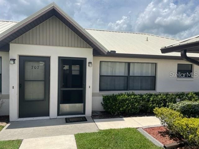 304 Villaway, Sebring, FL 33876 - property entrance with a metal roof