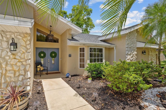 2474 Rio De Janeiro Ave, Punta Gorda, FL 33983 - entrance to property featuring stone siding, stucco siding, and a shingled roof