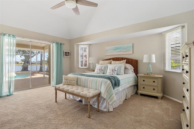 2474 Rio De Janeiro Ave, Punta Gorda, FL 33983 - bedroom featuring access to outside, light colored carpet, vaulted ceiling, ceiling fan, and a water view