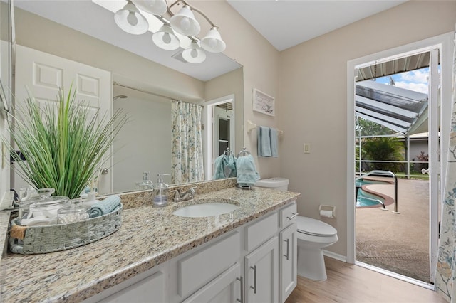 2474 Rio De Janeiro Ave, Punta Gorda, FL 33983 - full bathroom with a chandelier, wood finished floors, vanity, and curtained shower