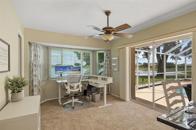 2474 Rio De Janeiro Ave, Punta Gorda, FL 33983 - carpeted home office featuring ceiling fan and a water view