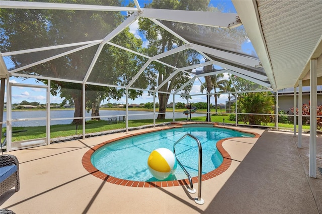 2474 Rio De Janeiro Ave, Punta Gorda, FL 33983 - swimming pool featuring a patio, a water view, and glass enclosure