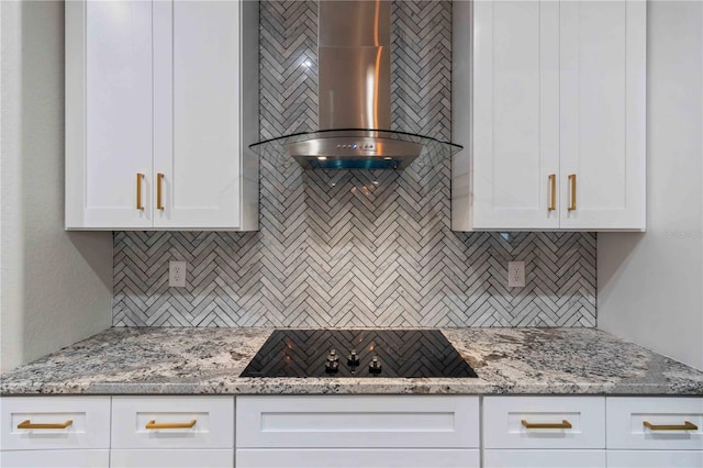 4026 Vasco St, Punta Gorda, FL 33950 - kitchen featuring wall chimney exhaust hood, black electric cooktop, decorative backsplash, and white cabinets