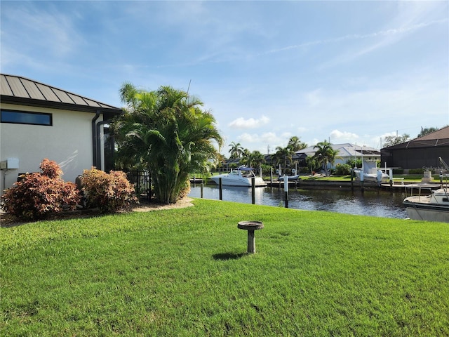 110 Hibiscus Dr, Punta Gorda, FL 33950 - view of grassy yard featuring a water view and a boat dock