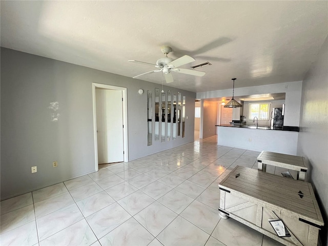 25225 Rampart Blvd Unit 502, Punta Gorda, FL 33983 - unfurnished living room featuring ceiling fan and light tile patterned flooring