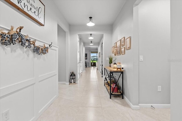 2596 Buckthorn Loop, North Port, FL 34289 - hallway featuring light tile patterned floors and baseboards