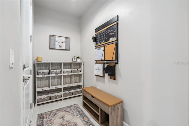 2596 Buckthorn Loop, North Port, FL 34289 - mudroom featuring baseboards