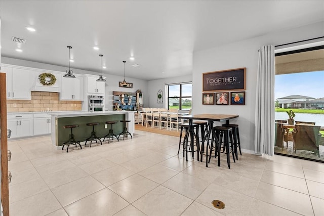2596 Buckthorn Loop, North Port, FL 34289 - dining area with light tile patterned floors and recessed lighting