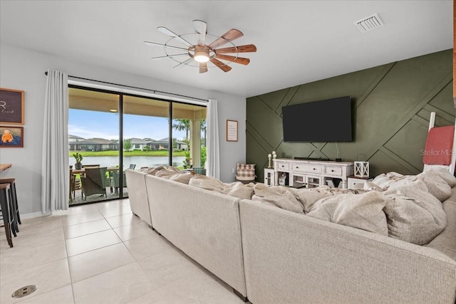 2596 Buckthorn Loop, North Port, FL 34289 - living room featuring ceiling fan and light tile patterned flooring