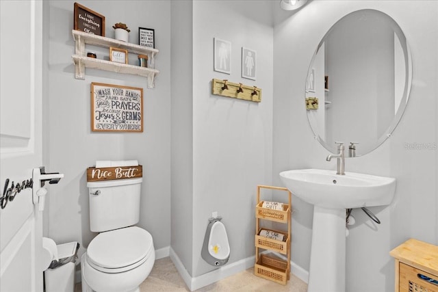 2596 Buckthorn Loop, North Port, FL 34289 - half bath featuring toilet and tile patterned floors