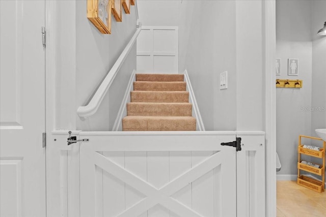 2596 Buckthorn Loop, North Port, FL 34289 - stairway featuring baseboards