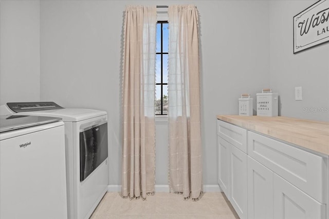 2596 Buckthorn Loop, North Port, FL 34289 - laundry area with washer and clothes dryer and cabinet space