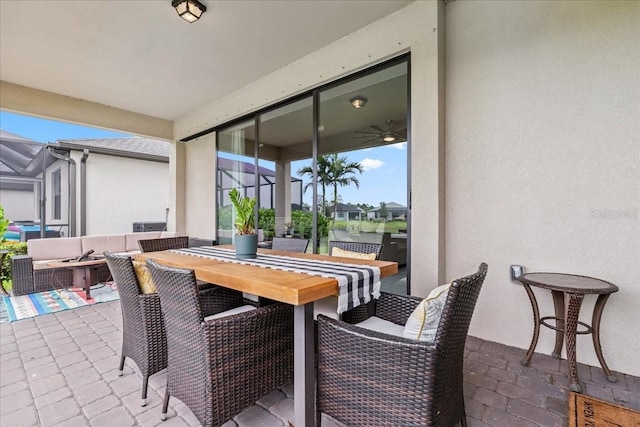 2596 Buckthorn Loop, North Port, FL 34289 - view of patio / terrace featuring outdoor dining area, glass enclosure, and an outdoor living space