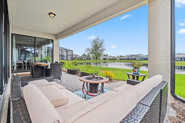 2596 Buckthorn Loop, North Port, FL 34289 - view of patio featuring an outdoor living space with a fire pit, a water view, a residential view, and outdoor dining area