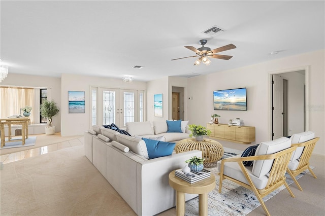 1457 Sea Fan Dr, Punta Gorda, FL 33950 - living area with ceiling fan, french doors, and light colored carpet