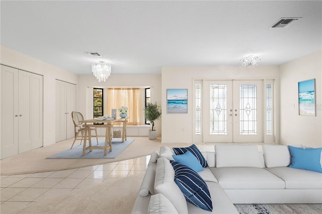 1457 Sea Fan Dr, Punta Gorda, FL 33950 - carpeted living area with a chandelier and tile patterned flooring