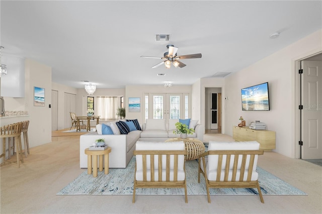 1457 Sea Fan Dr, Punta Gorda, FL 33950 - carpeted living room with french doors and ceiling fan