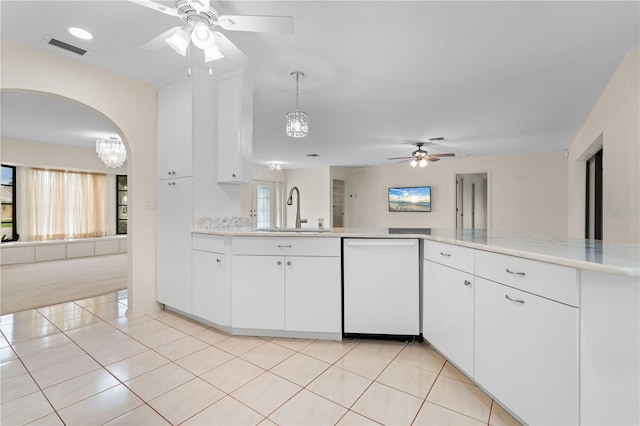 1457 Sea Fan Dr, Punta Gorda, FL 33950 - kitchen with dishwasher, ceiling fan, white cabinets, and light tile patterned floors