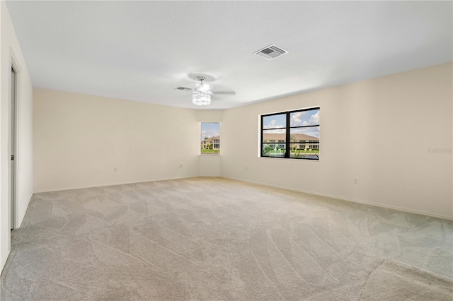1457 Sea Fan Dr, Punta Gorda, FL 33950 - empty room featuring light colored carpet and a ceiling fan