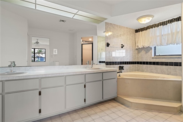1457 Sea Fan Dr, Punta Gorda, FL 33950 - full bathroom with a bath, tile patterned floors, double vanity, a shower, and a ceiling fan