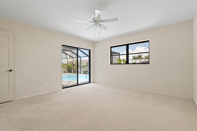 1457 Sea Fan Dr, Punta Gorda, FL 33950 - spare room with carpet flooring, ceiling fan, and a sunroom