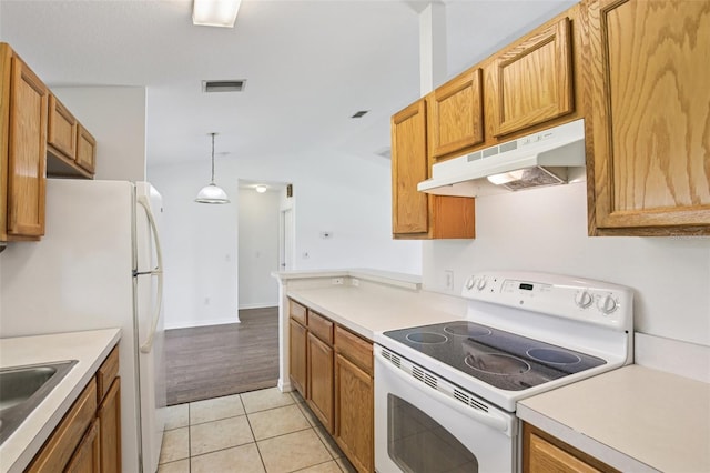 5260 Jessamine Ave, North Port, FL 34291 - kitchen featuring white appliances, under cabinet range hood, and light countertops