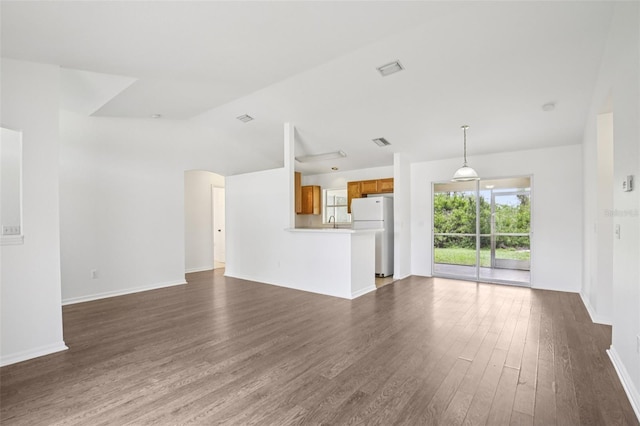 5260 Jessamine Ave, North Port, FL 34291 - unfurnished living room featuring dark wood-type flooring and vaulted ceiling