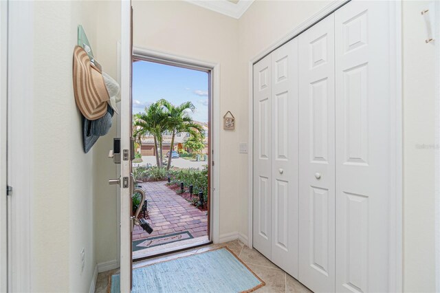 20333 Lagente Cir, Venice, FL 34293 - entryway with light tile patterned floors and ornamental molding
