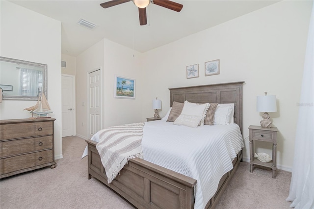 20333 Lagente Cir, Venice, FL 34293 - bedroom featuring light carpet, a closet, and a ceiling fan
