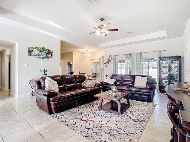 1323 Algiers St, Punta Gorda, FL 33980 - living room with a raised ceiling, light tile patterned flooring, and a ceiling fan