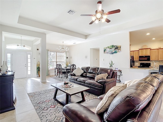 1323 Algiers St, Punta Gorda, FL 33980 - living area with ceiling fan, a raised ceiling, light tile patterned floors, a chandelier, and recessed lighting
