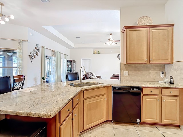 1323 Algiers St, Punta Gorda, FL 33980 - kitchen with dishwasher, light brown cabinetry, tasteful backsplash, and light tile patterned floors
