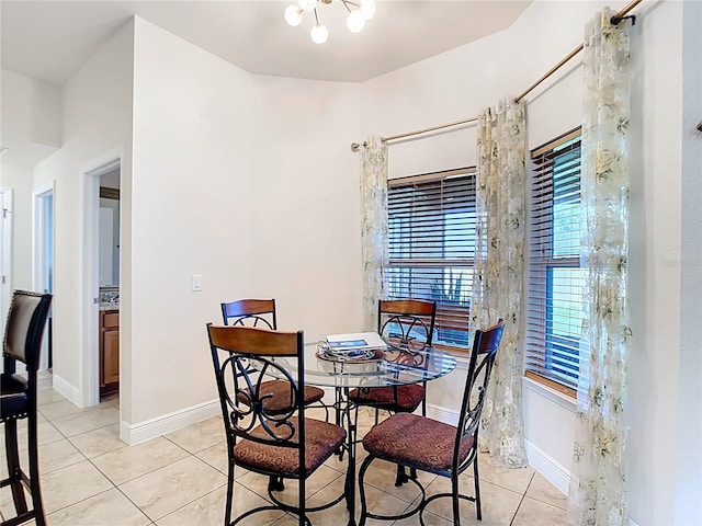 1323 Algiers St, Punta Gorda, FL 33980 - dining area featuring light tile patterned flooring, plenty of natural light, and a chandelier
