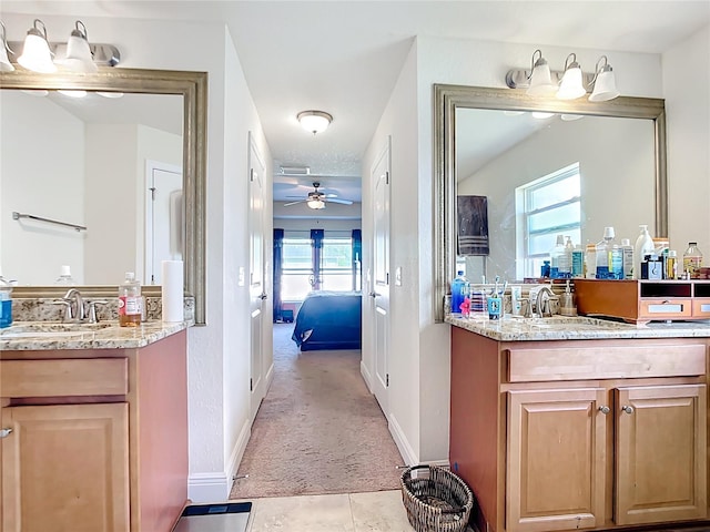 1323 Algiers St, Punta Gorda, FL 33980 - ensuite bathroom featuring a ceiling fan, two vanities, and tile patterned flooring