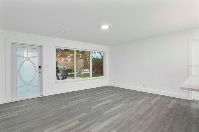 1541 NE 32nd Pl, Pompano Beach, FL 33064 - unfurnished living room with wood finished floors and crown molding