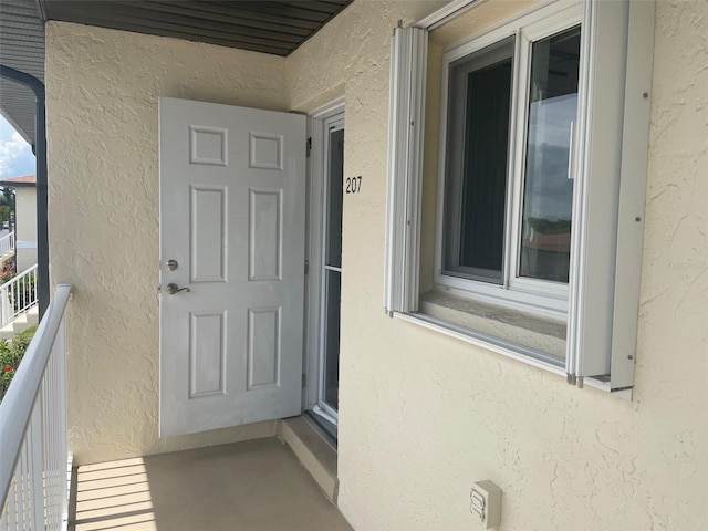 25275 Rampart Blvd Unit 207, Punta Gorda, FL 33983 - entrance to property with stucco siding