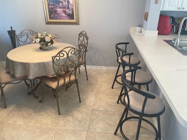 25275 Rampart Blvd Unit 207, Punta Gorda, FL 33983 - dining space with light tile patterned floors and baseboards