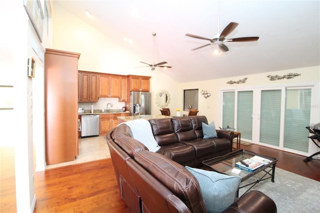 25188 Marion Ave Unit 24, Punta Gorda, FL 33950 - living room with ceiling fan, light wood-type flooring, and high vaulted ceiling