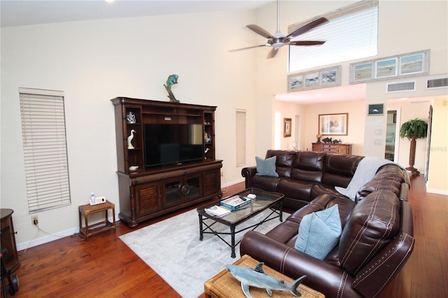 25188 Marion Ave Unit 24, Punta Gorda, FL 33950 - living room featuring a ceiling fan, dark wood-style floors, and a high ceiling