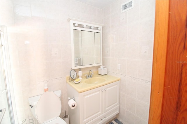 25188 Marion Ave Unit 24, Punta Gorda, FL 33950 - bathroom featuring tile walls and vanity
