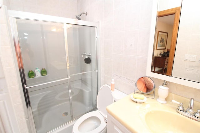 25188 Marion Ave Unit 24, Punta Gorda, FL 33950 - bathroom with tile walls, decorative backsplash, a stall shower, and vanity