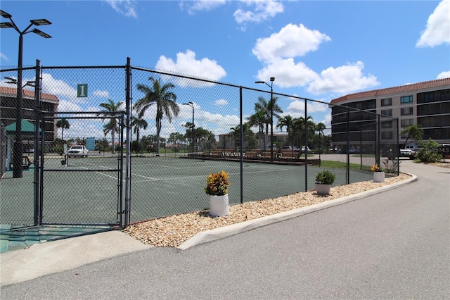 25188 Marion Ave Unit 24, Punta Gorda, FL 33950 - view of tennis court featuring a gate