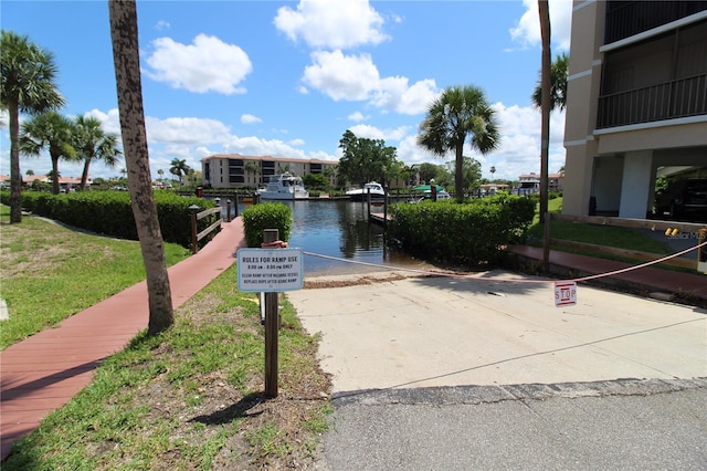 25188 Marion Ave Unit 24, Punta Gorda, FL 33950 - view of property's community with a water view, a boat ramp, and a boat dock