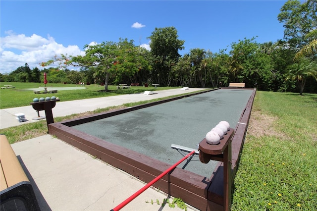 25188 Marion Ave Unit 24, Punta Gorda, FL 33950 - view of property's community featuring a game area, a yard, and view of wooded area