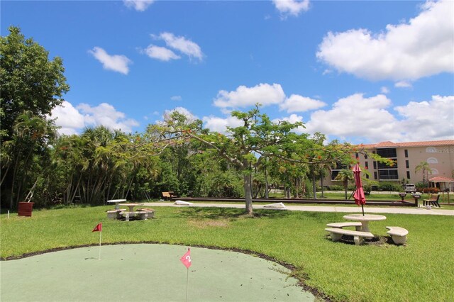 25188 Marion Ave Unit 24, Punta Gorda, FL 33950 - view of home's community with a putting area and a yard